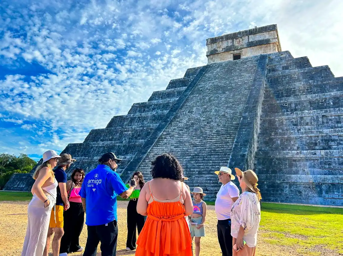 Guide leading the group through Chichen Itza on the Coba combo tour