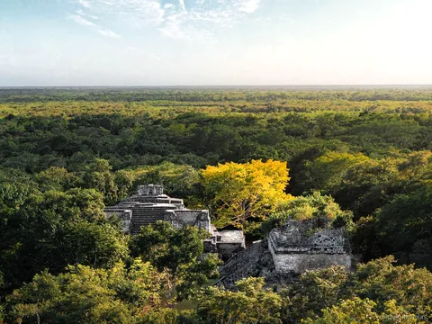 Guide explaining Maya cosmology at Chichen Itza on the Ek Balam combo tour